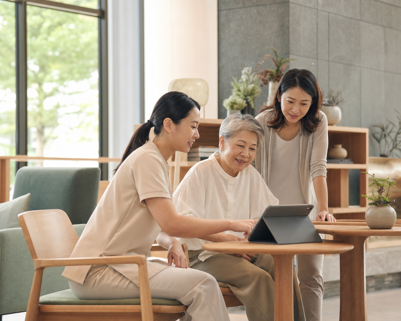 A resident, guardian, and care professional reviewing care information together